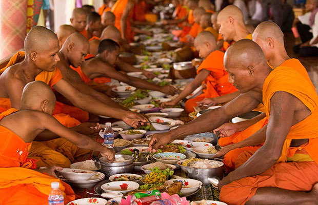 Monks having lunch during Pchum Ben Festival