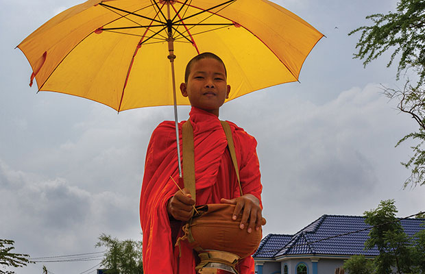 Monk teaching local youth Khmer language. PROVIDENCE, RI ï¿½ At the Buddhist